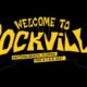 Logo for Welcome to Rockville festival in bold yellow letters on black, showing Daytona Beach, Florida and May 6–9, 2027